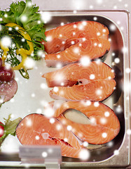 Image showing salmon fish fillet in metal tray on ice at grocery