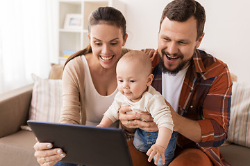 Image showing mother, father and baby with tablet pc at home