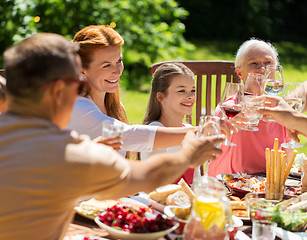 Image showing happy family having dinner or summer garden party