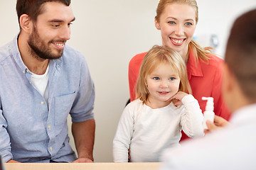 Image showing happy family with daughter and doctor at clinic