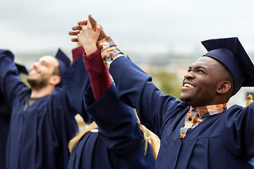 Image showing happy students celebrating graduation