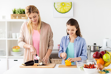 Image showing happy family cooking dinner at home kitchen