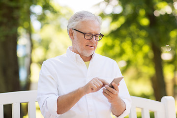 Image showing senior man with smartphone at summer park