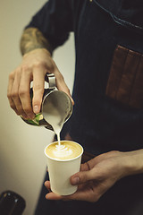 Image showing Bartender pouring coffee to cup