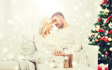 Image showing happy couple at home with christmas tree