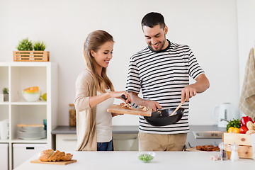 Image showing couple cooking food at home kitchen