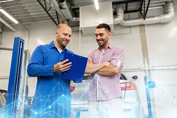 Image showing auto mechanic with clipboard and man at car shop