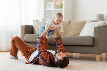 Image showing happy father with little baby boy at home