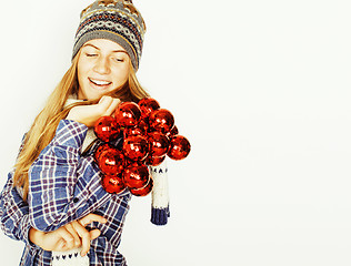 Image showing young pretty blond teenage girl in winter hat and scarf on white background smiling