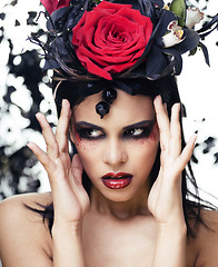 Image showing pretty brunette woman with rose jewelry, black and red, bright make up kike a vampire closeup