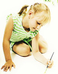 Image showing little cute blond girl painting isolated on white background