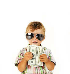 Image showing young cute boy holding lot of cash, american dollars isolated close up