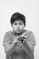 Image showing kid blowing confetti