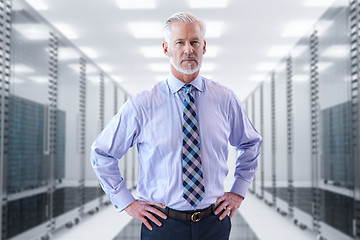 Image showing Senior businessman in server room