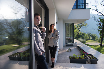 Image showing couple enjoying on the door of their luxury home villa