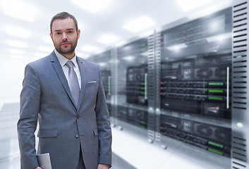 Image showing Young businessman in server room