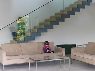 Image showing little girl playing games on smartphone