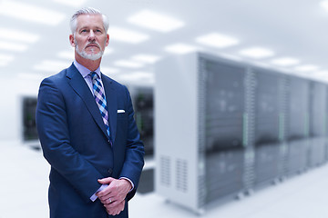 Image showing Senior businessman in server room