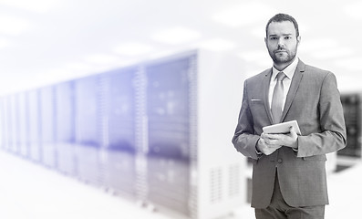 Image showing Young businessman in server room