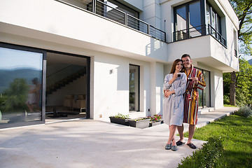 Image showing Young beautiful couple in bathrobes