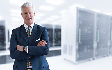 Image showing Senior businessman in server room