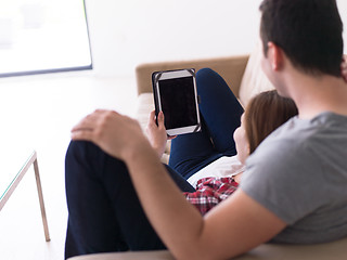 Image showing couple relaxing at  home with tablet computers