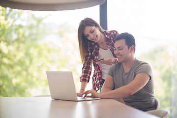 Image showing happy young couple buying online