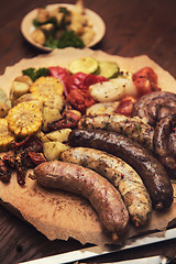 Image showing Grilled sausages with vegetables