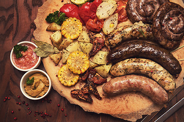 Image showing Grilled sausages with vegetables