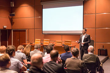 Image showing Business speaker giving a talk at business conference event.