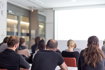 Image showing Audience in the lecture hall listening to academic presentation.