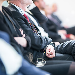 Image showing Row of business people sitting at seminar.