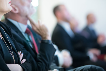 Image showing Row of business people sitting at seminar.