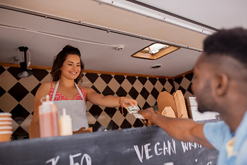 Image showing african american man buying wok at food truck