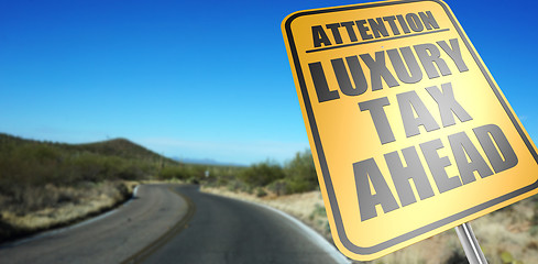 Image showing Luxury tax ahead road sign