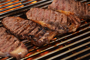 Image showing Beef steaks on the grill