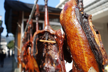 Image showing The meat drying outside on the sun