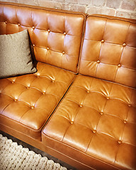 Image showing Luxurious brown leather sofa with cushion