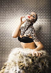 Image showing young sexy woman with leopard make up all over body, cat bodyart