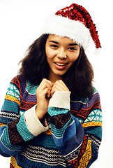 Image showing cute young real african hipster girl in santas red hat isolated 