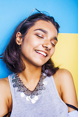 Image showing lifestyle people concept. young pretty smiling indian girl with long nails wearing lot of jewelry rings, asian summer happy cool
