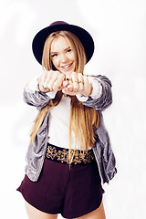 Image showing young pretty hipster girl in hat posing smiling cheerful on white background, lifestyle people concept