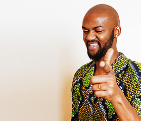 Image showing portrait of young handsome african man wearing bright green nati