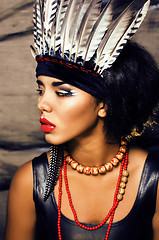 Image showing young pretty woman with make up like red indian, futher in hair,