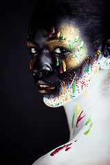 Image showing woman with creative makeup closeup like drops of colors, facepai