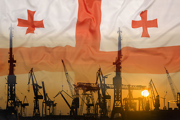 Image showing Industrial concept with Georgia flag at sunset