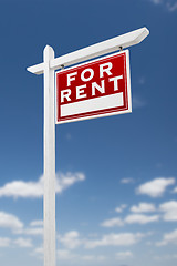 Image showing Right Facing For Rent Real Estate Sign on a Blue Sky with Clouds