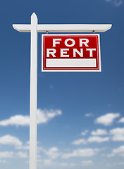 Image showing Right Facing For Rent Real Estate Sign on a Blue Sky with Clouds