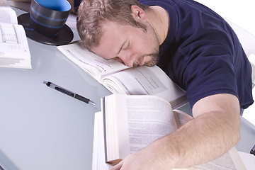 Image showing College Student Sleeping on his Desk