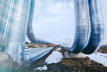 Image showing Industrial zone, Steel pipelines and valves against blue sky